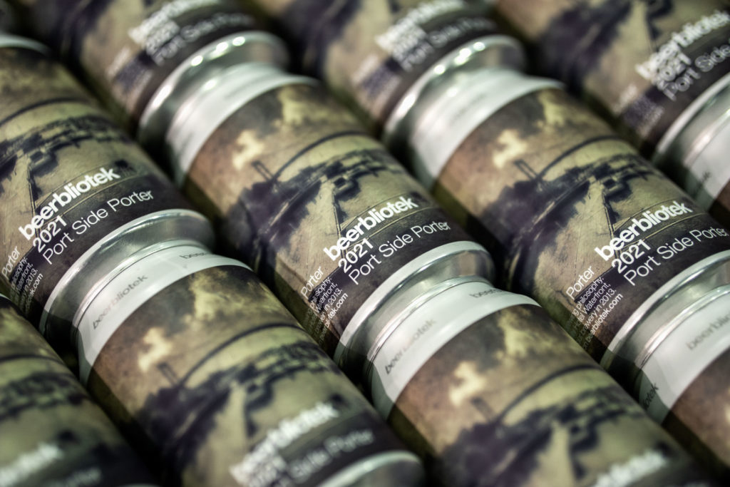 Photo of a pattern of cans of Port Side Porter, a Porter brewed in Gothenburg, by Swedish Craft Brewery Beerbliotek.First brewed in 2013, recreated for Hotel waterfront, Gothenburg.